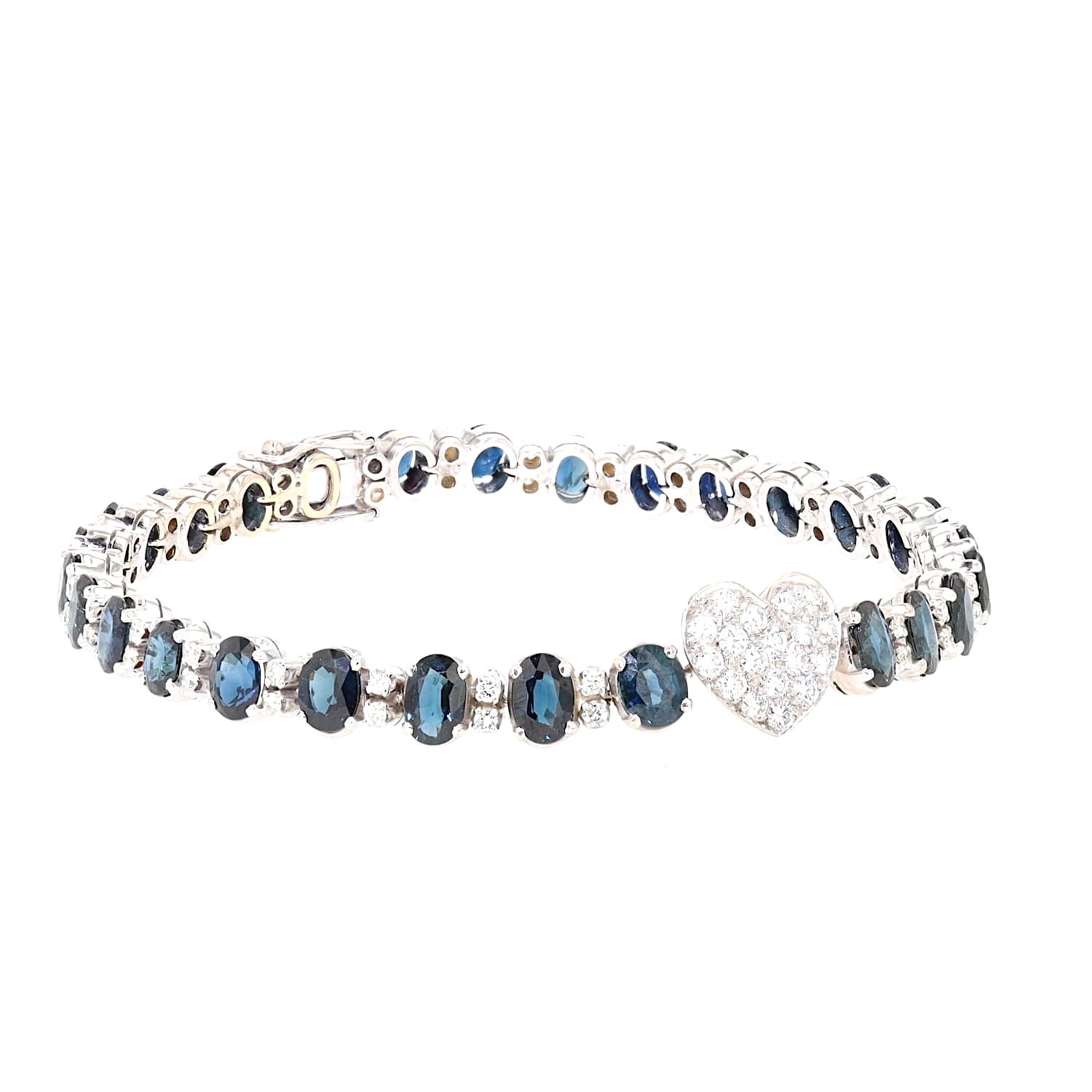 Armband in 750er und 585er Weißgold mit insgesamt ca. 1,3 ct Brillanten und ca. 10,5 ct. blauen Saphiren,liegend geschlossen leicht rechts gedreht