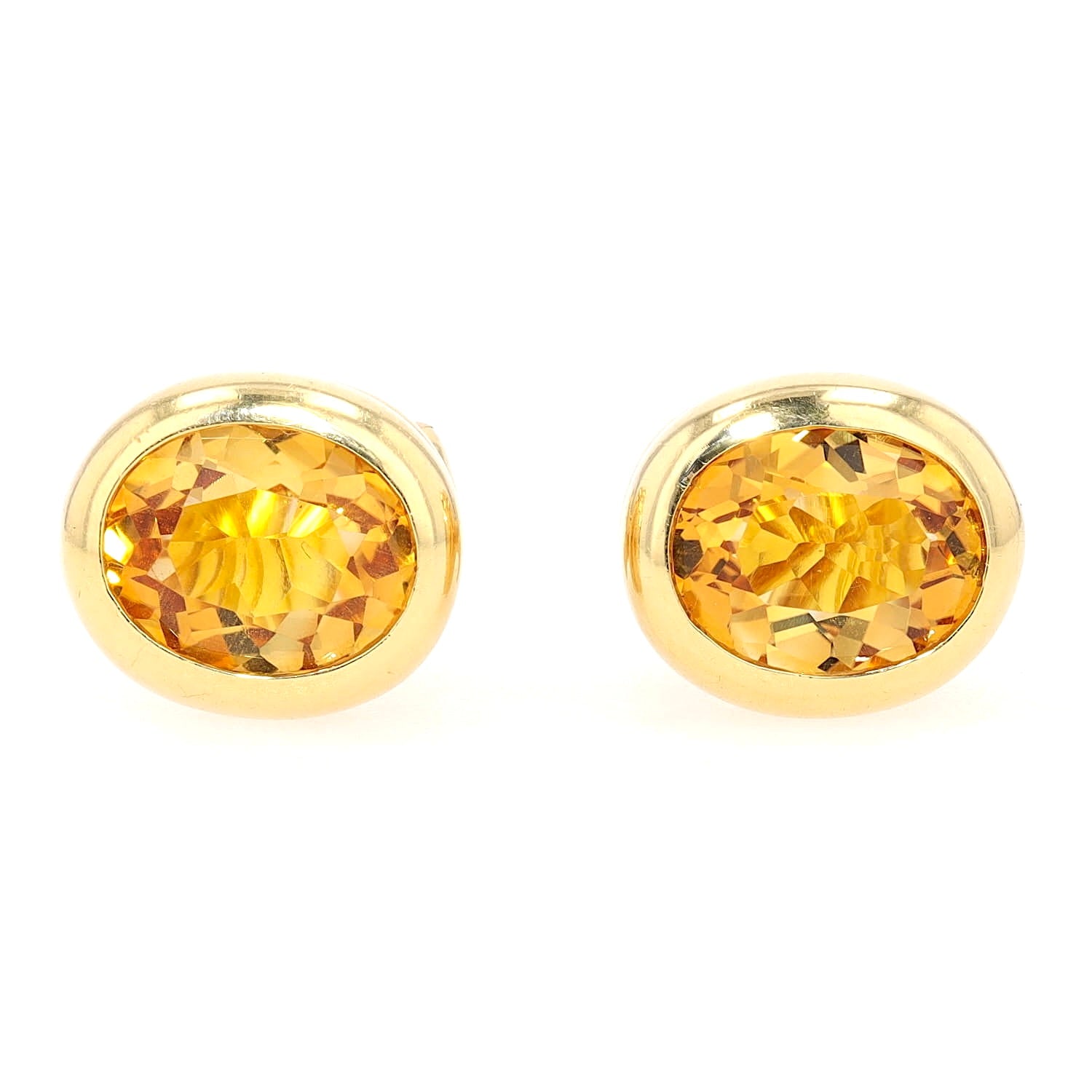 Pair of ear clips in 750 yellow gold with citrines, lying frontally