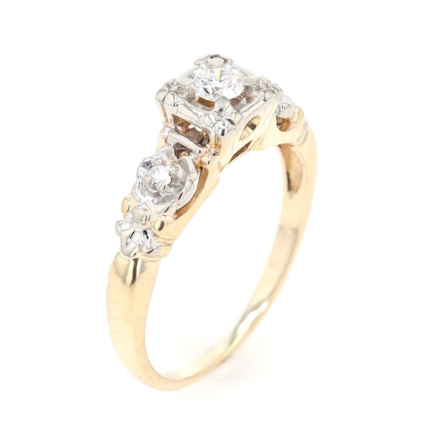 Ring in 585er Gelb- und Weißgold mit einem Brillanten und 2 Diamanten, stehend
