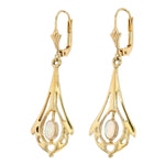 Art Nouveau earrings in 333 yellow gold, each with an opal, hanging turned left