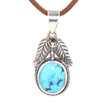 Pendant in 925 silver with a turquoise imitation, hanging on a brown leather strap at the front