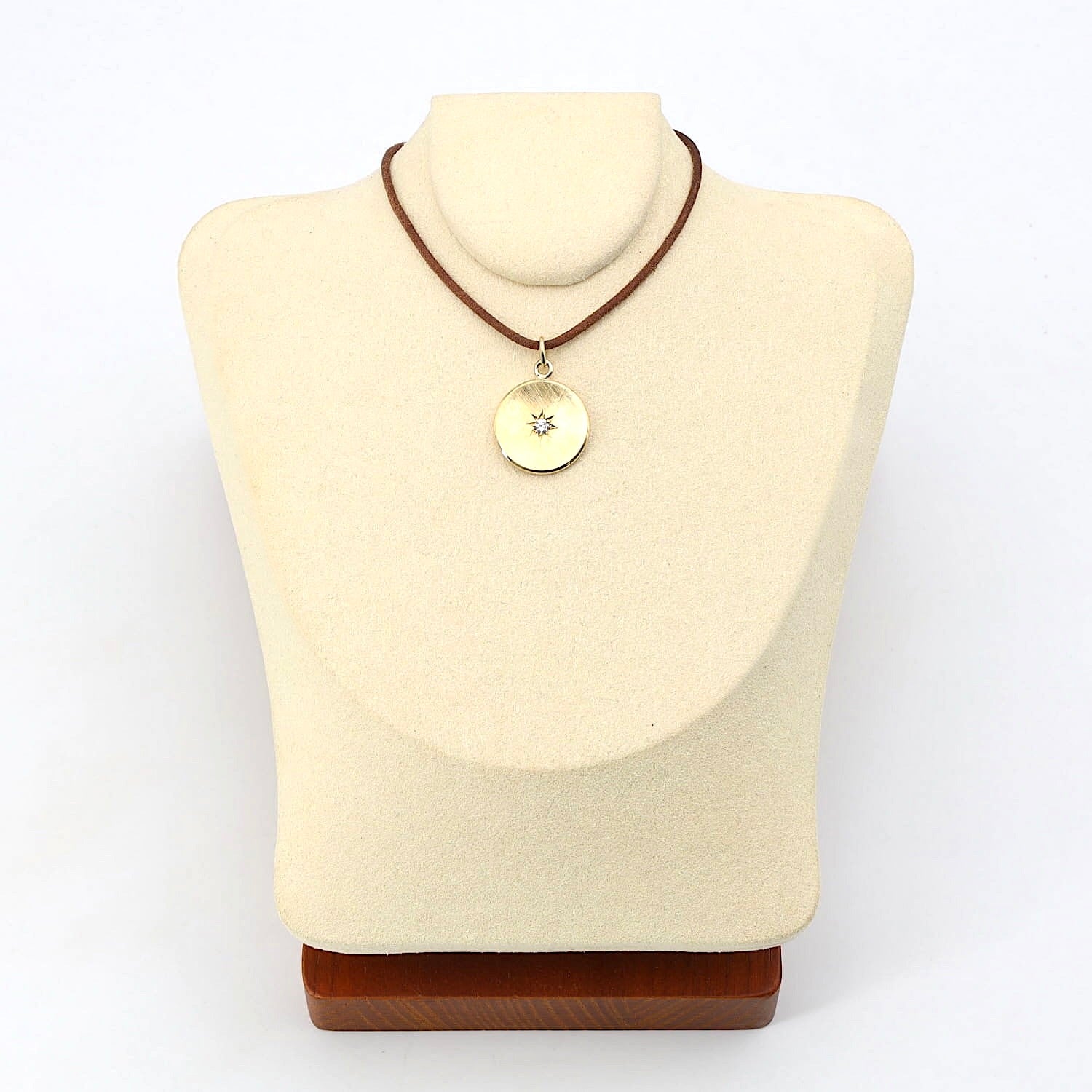 Anhänger in 585er Gelbgold mit einem Brillanten, an der Büste