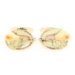 Manschettenknöpfe in 585er Gelbgold-Rotgold mit je einer Grandeln, liegend frontal