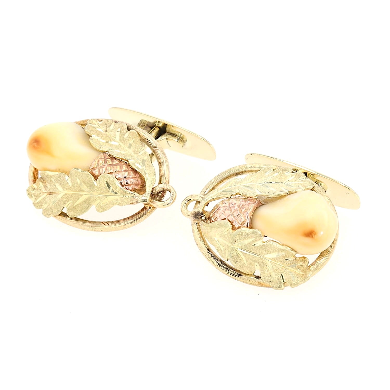 Manschettenknöpfe in 585er Gelbgold-Rotgold mit je einer Grandeln, liegend links gedreht