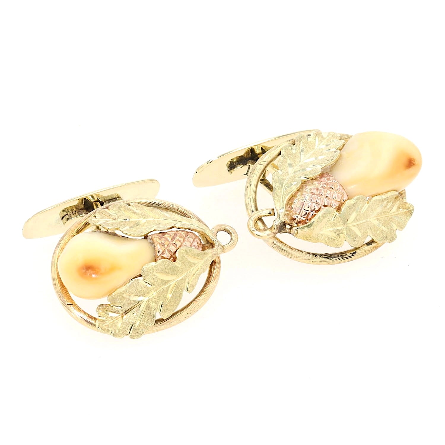 Manschettenknöpfe in 585er Gelbgold-Rotgold mit je einer Grandeln, liegend rechts gedreht