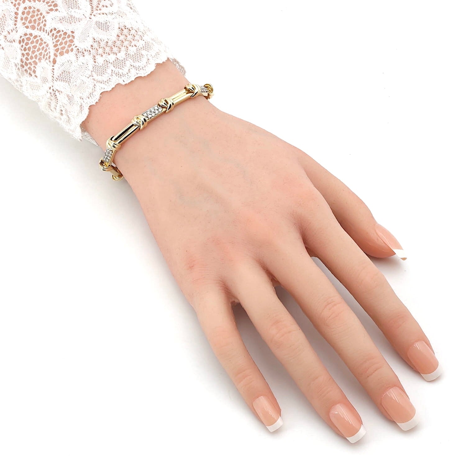 Bracelet in 585 yellow gold with a total of approx. 1.0 ct Brilliants, on an artificial hand