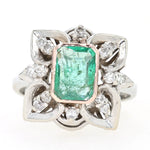 Art Deco ring made of 750 white gold with an emerald and diamonds, lying frontally