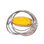 brooch in 925 silver with an amber, standing frontally turned to the left
