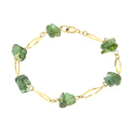 Bracelet in 333 yellow gold with green tourmaline tumbled stones, lying closed top view