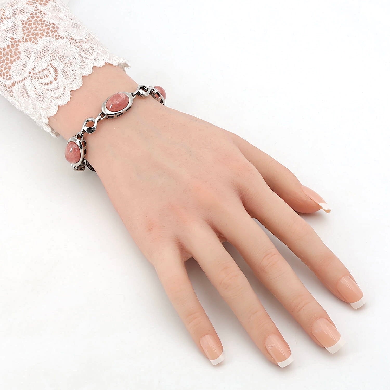 Bracelet in 835 silver with rhodochrosite cabochons, on an artificial arm
