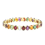 Armband in 750er Gelbgold mit bunten Edelsteinen aus Aquamarin, Citrin, Amethyst, Turmalin und Granat, liegend geschlossen leicht gedreht
