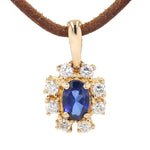 Anhänger in 585er Gelbgold mit einem synthetischen blauen Saphir und Brillanten, hängend frontal von vorne