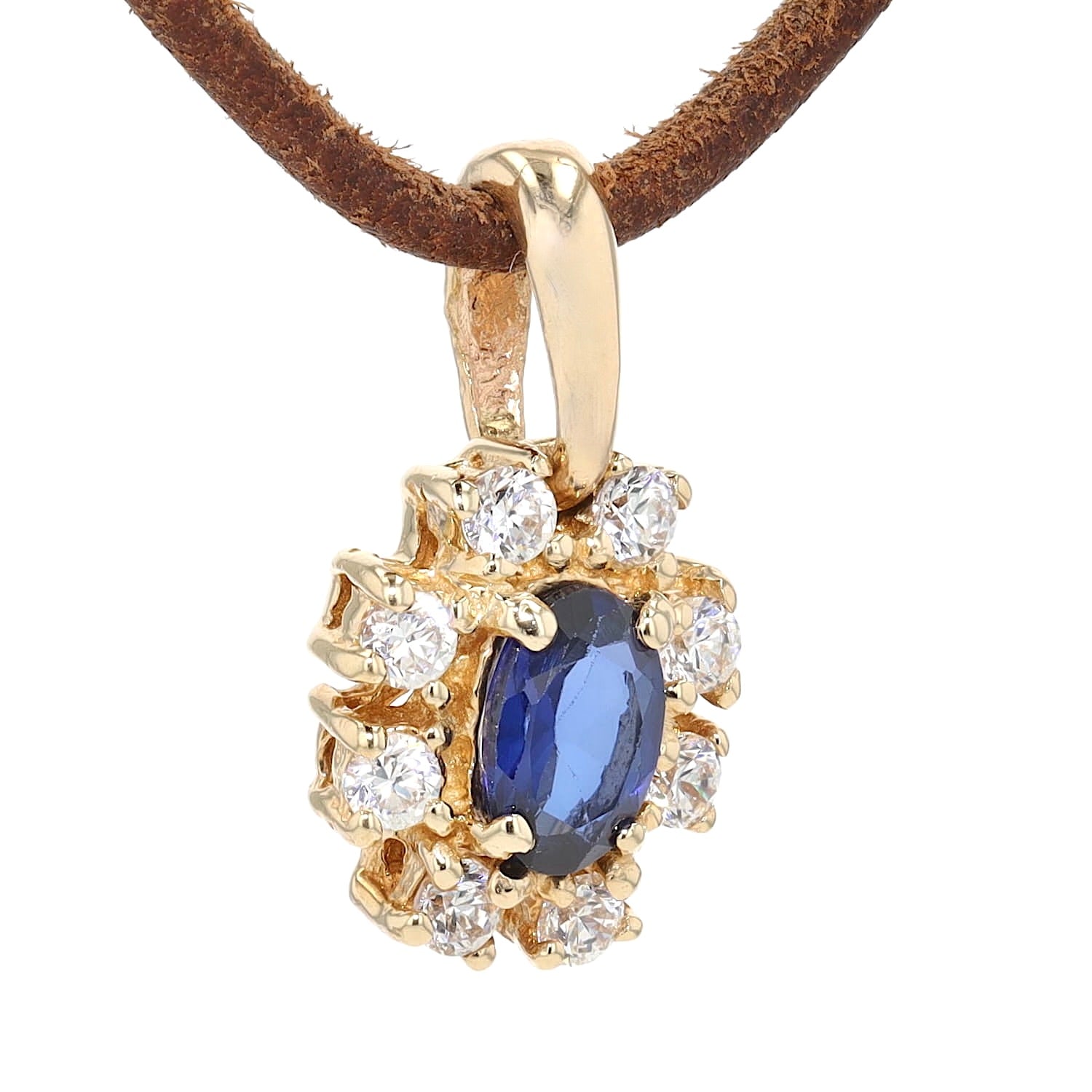 Anhänger in 585er Gelbgold mit einem synthetischen blauen Saphir und Brillanten, hängend leicht rechts gedreht