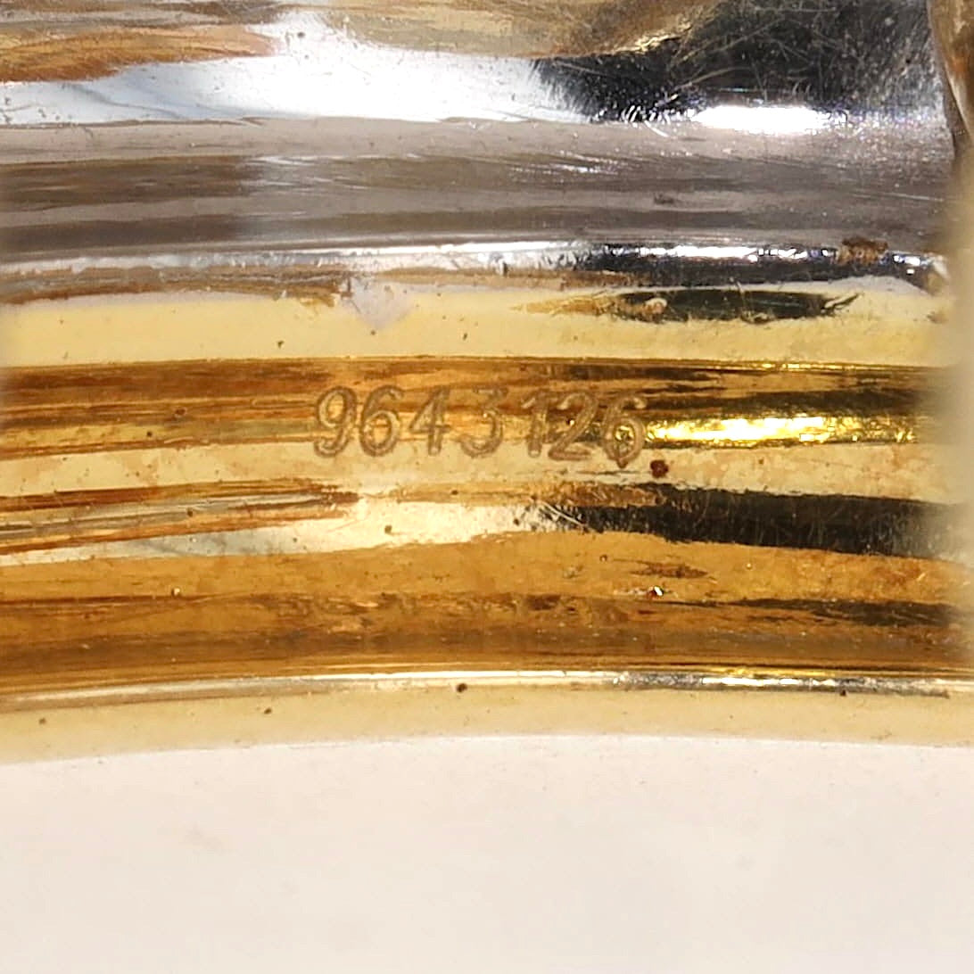 Chopard half hoop earrings in 750 Trivcolor gold, each with a blue sapphire cabochon, another number