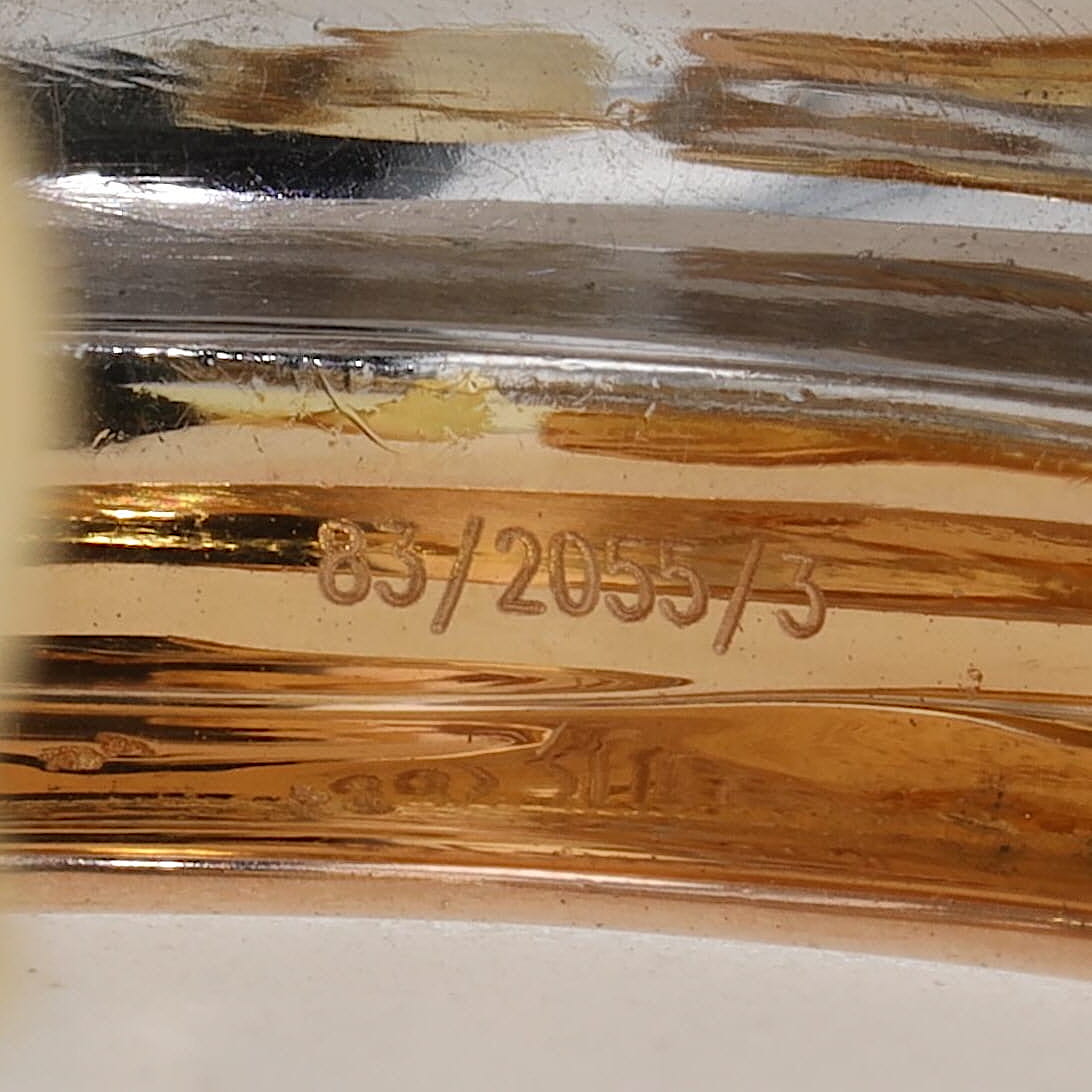 Chopard half hoop earrings in 750 Trivcolor gold, each with a blue sapphire cabochon, one number