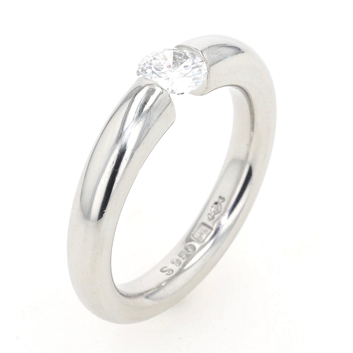 Niessing Spannring in 950er Platin mit einem Brillanten, ca. 0,50 ct , stehend