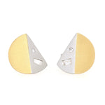 Stud earrings in platinum and 18k yellow gold with diamonds, lying frontally