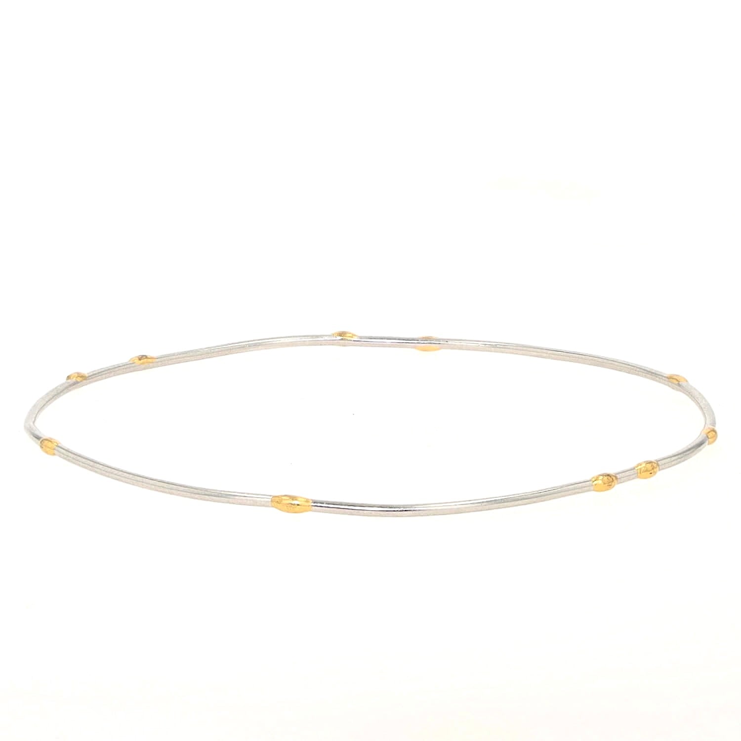 Armreif in 950er Platin mit goldenen Elementen, liegend links gedreht