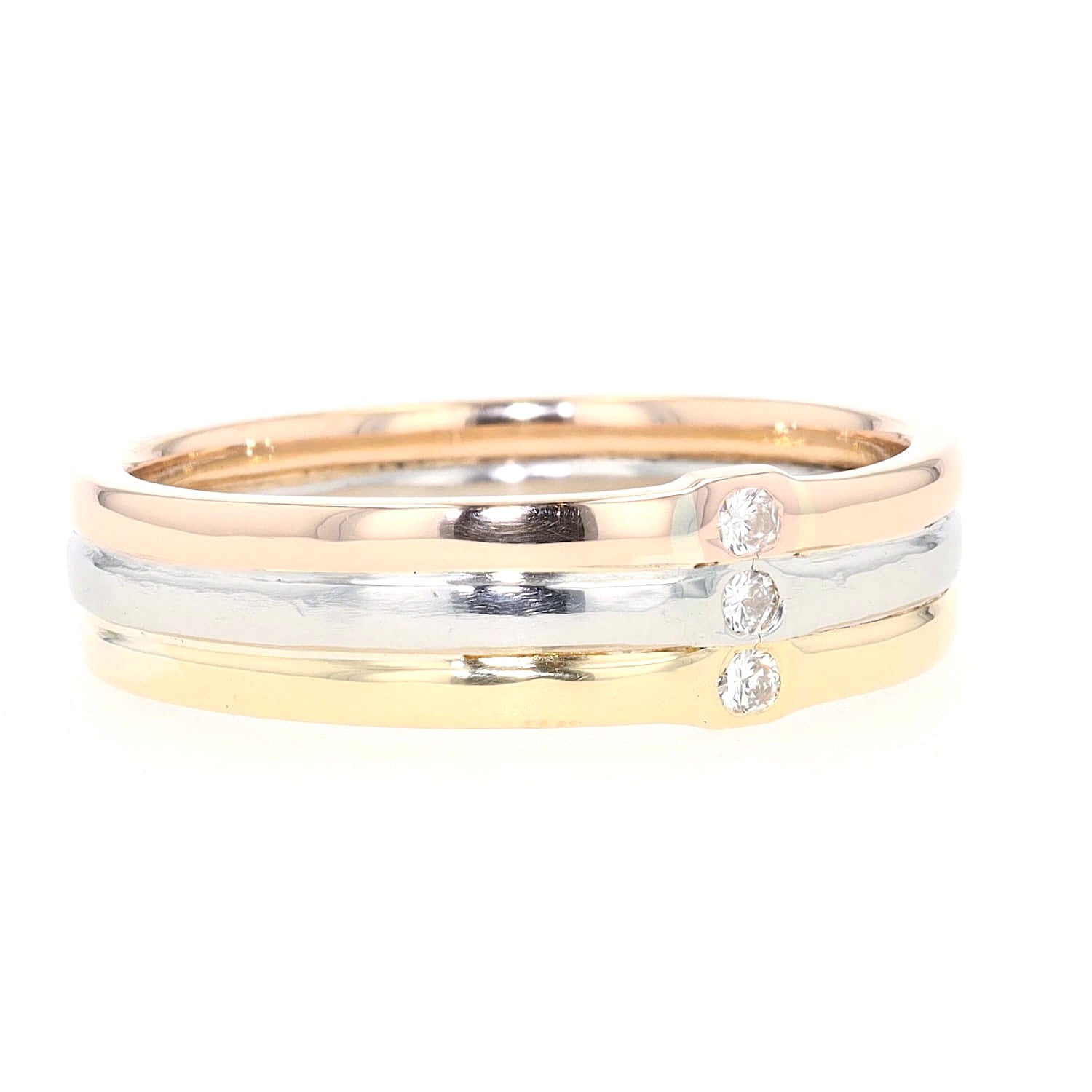 Niessing Ring Tricolor in zweifarbigen 750er Gold und Platin mit 3 Brillanten, liegend rechts gedreht