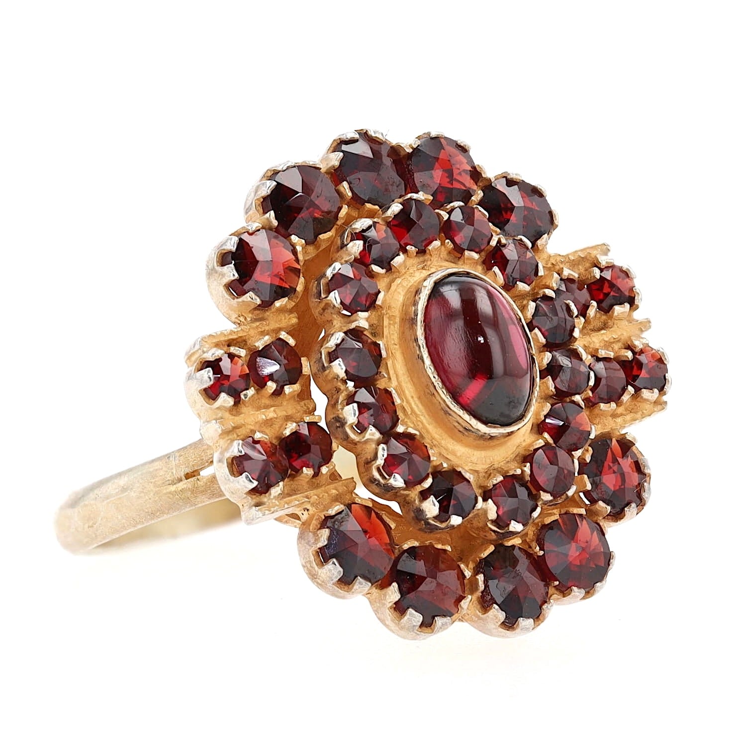 Ring made of 900 silver, gold-plated with garnets, turned lying on the right