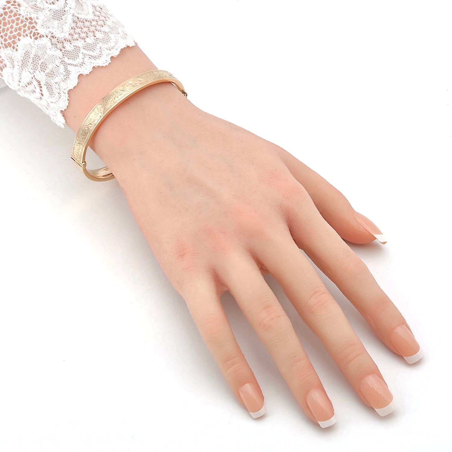 Armreif um 1910 aus 9 kt Rotgold, an einem künstlichen Arm