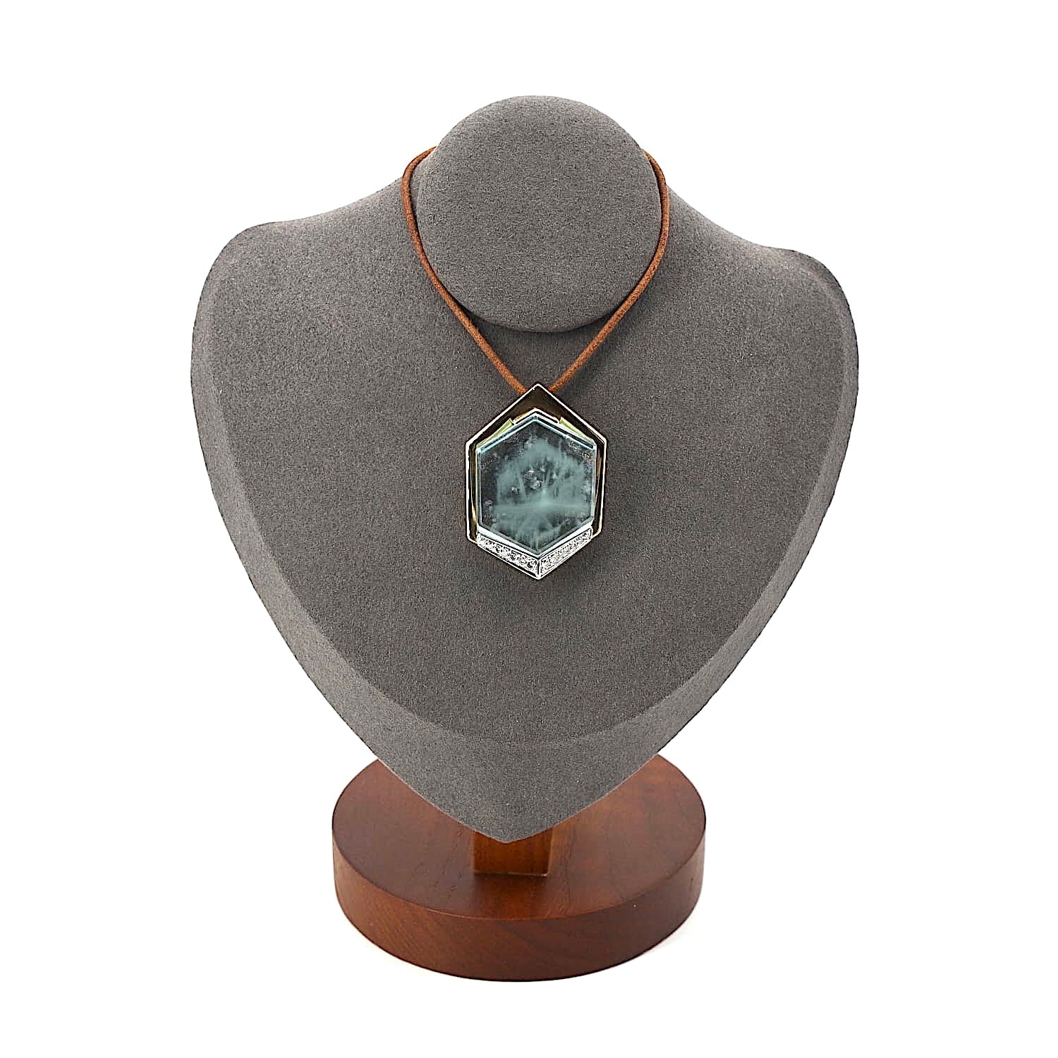 Pendant in 750 yellow gold with a large aquamarine weighing approx. 54 ct, on a dark bust