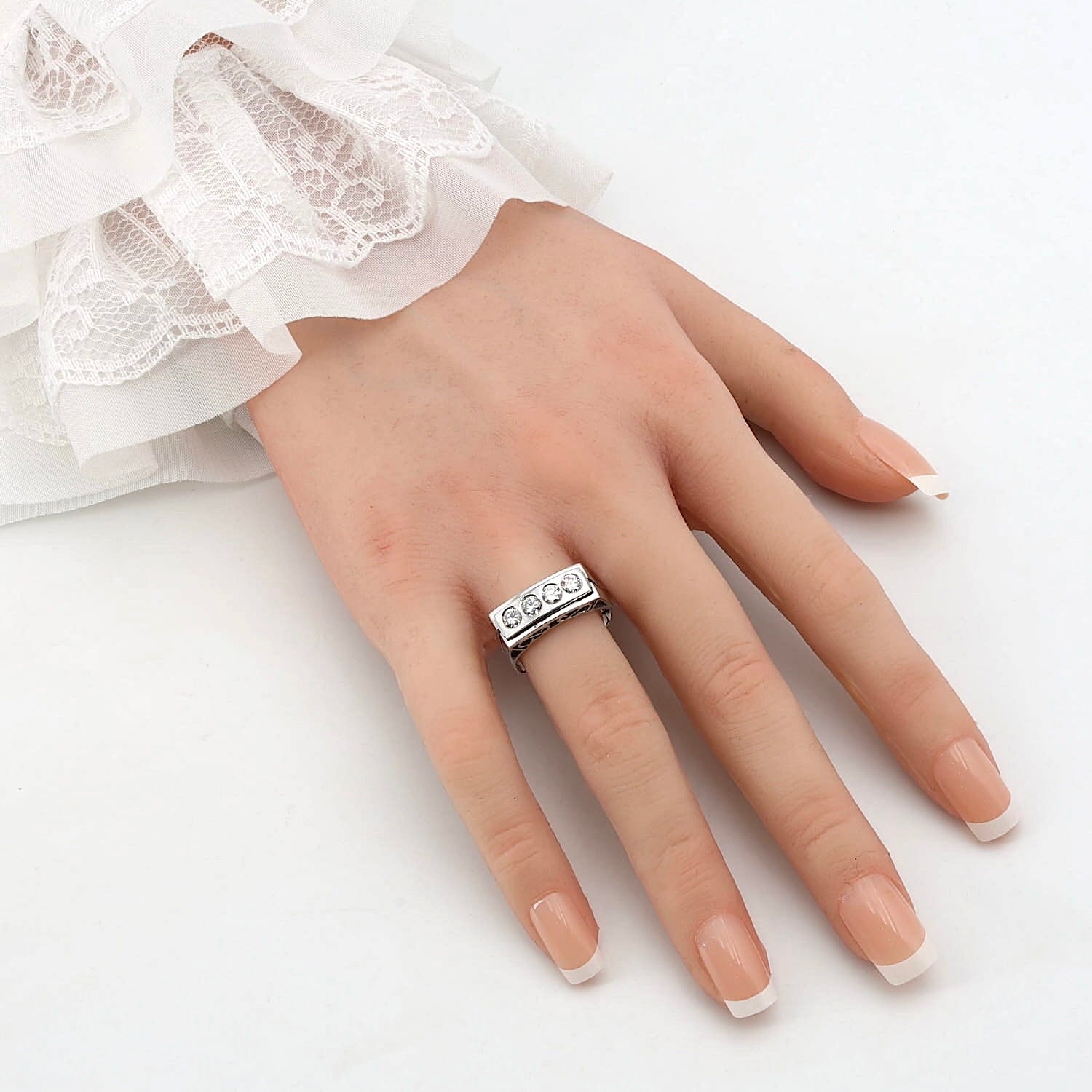 Ring in 750 white gold with a total of approx. 0.70 ct Brilliants, on an artificial hand