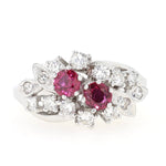 Cluster ring around 1970 in 585 white gold with rubies and diamonds, lying frontally