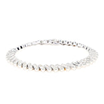 Tennis bracelet in 585 white gold with approx. 2.5 ct Brilliants, lying closed frontal slight top view