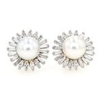 Pair of exclusive ear studs in 750 white gold, each with a South Seacultured pearl and a total of approx. 2.9 ct diamonds, lying frontally