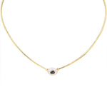 Omega-Reif in 585er Gelbgold mit einem blauen Saphir und Brillanten, hängend frontal