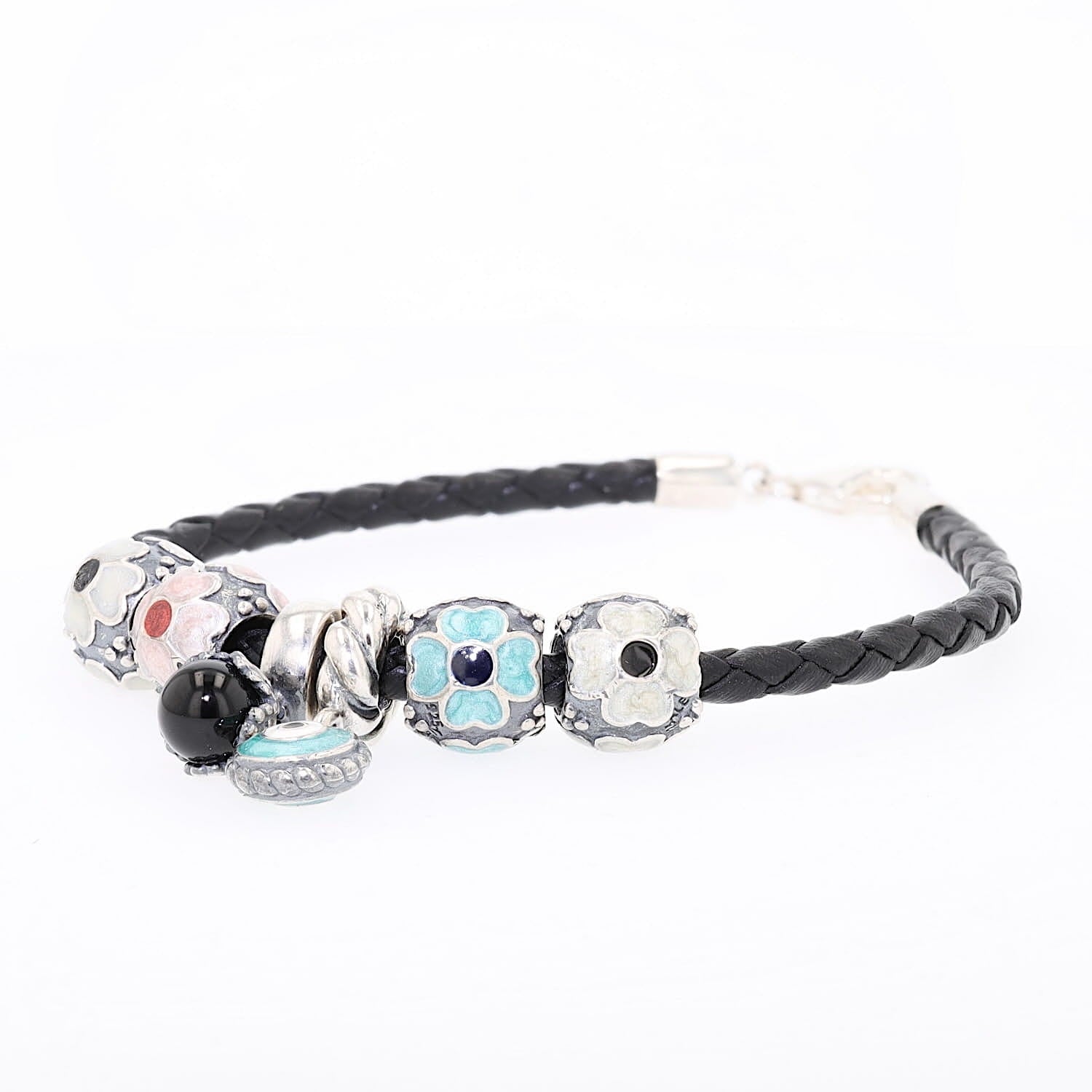 Bracelet in 925 silver with 6 charms from Pandora, closed lying down and slightly turned to the left