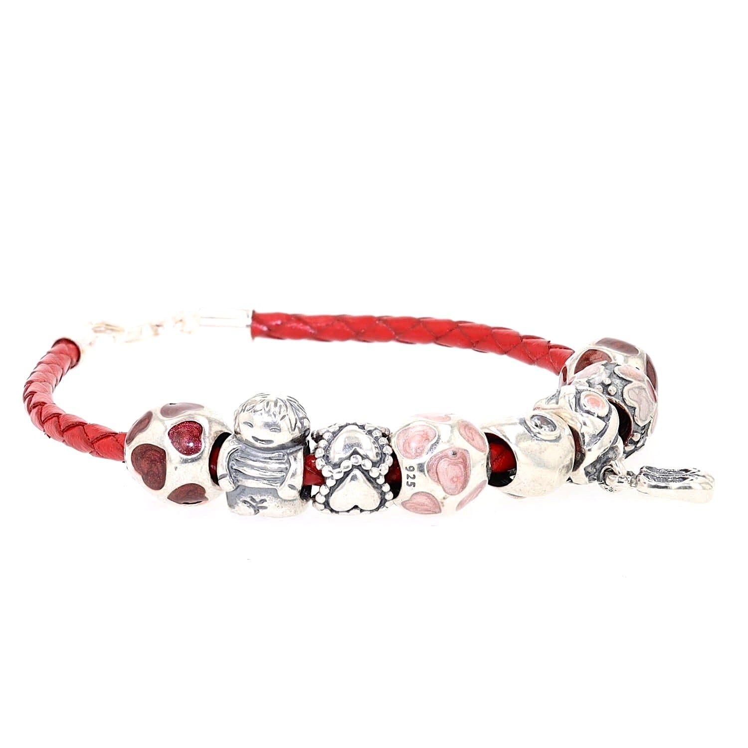 Red leather bracelet with 8 charms from Pandora, turned lying on the right