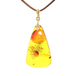 Amber pendant with a setting made of 835 silver, gold-plated, hanging frontally