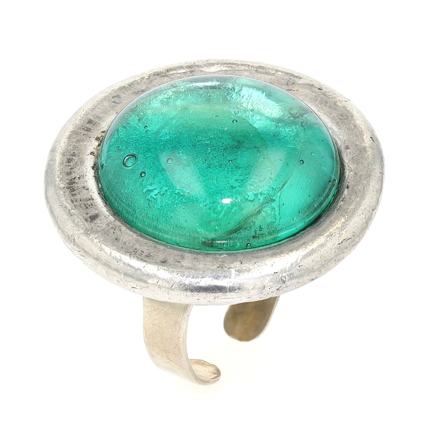 Statement ring made of pewter with a green glass stone, standing