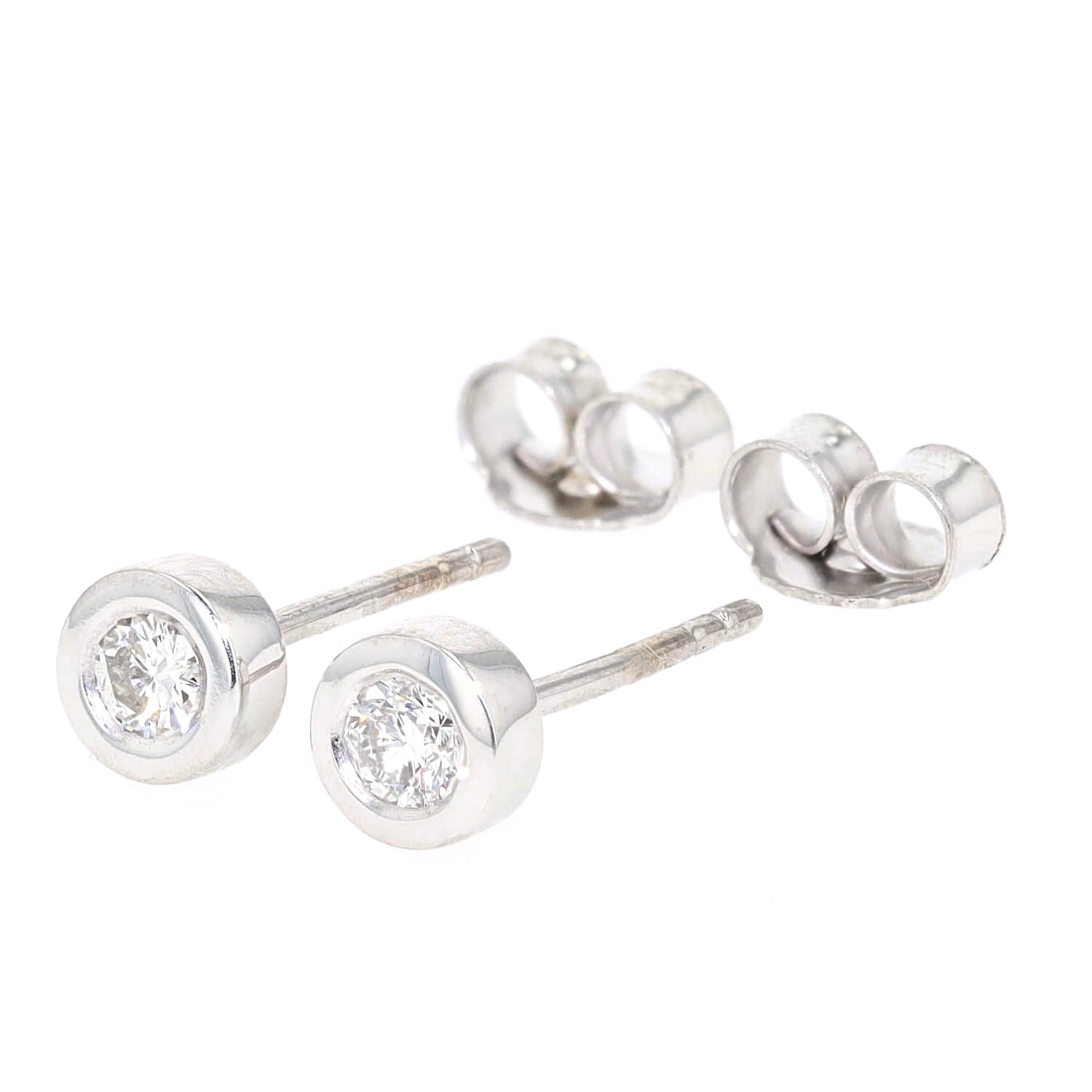 Ohrstecker in 585er Weißgold mit je einem Brillant gesamt ca. 0,20 ct, liegend links gedreht mit Stoppern