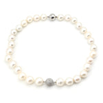 South Sea cultured pearl necklace with locks made of 585 and 750 white gold and Brilliants, lying closed top view