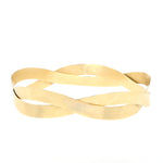 Niessing Papyr bracelet made of 750 yellow gold, lying frontally