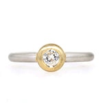 Ring in 950 platinum and 585 yellow gold with a brilliant, lying frontally