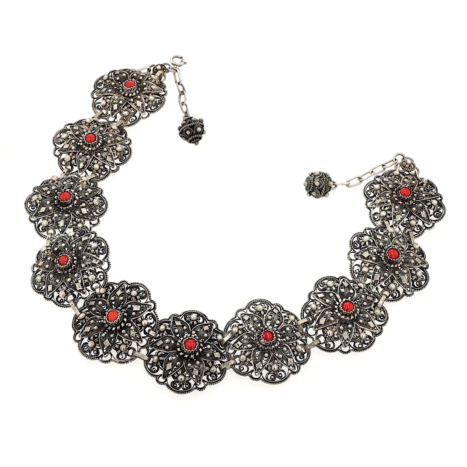 Short traditional jewelry necklace/collar in 925 silver with imitation coral, lying not completely closed, slightly turned to the left