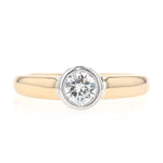 Christ Ring in 585er Gelb- und Weißgold mit einem Brillanten ca. 0,56 ct, liegend frontal