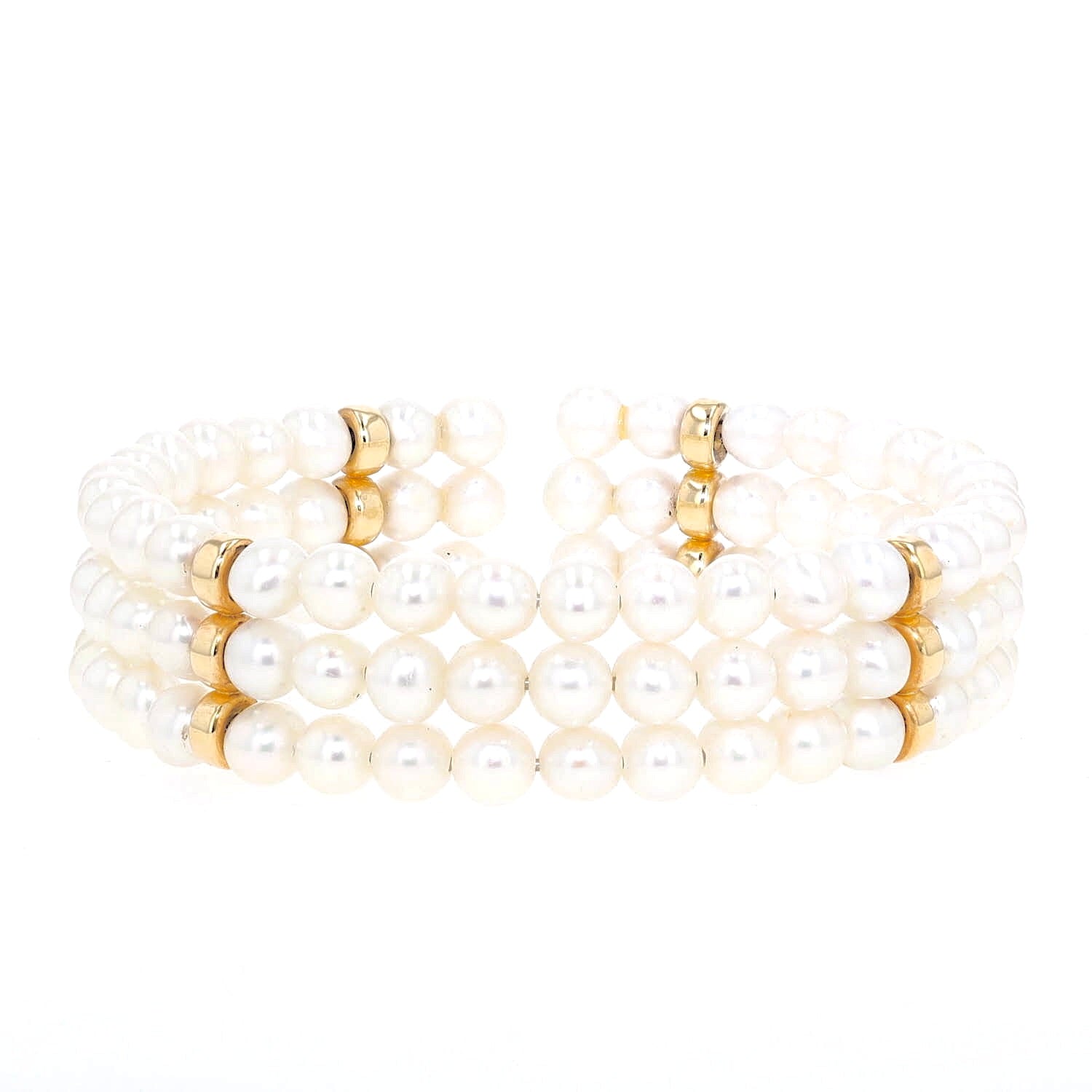 Bangle with 3 rows of cultured pearls and 585 gold elements, lying frontally