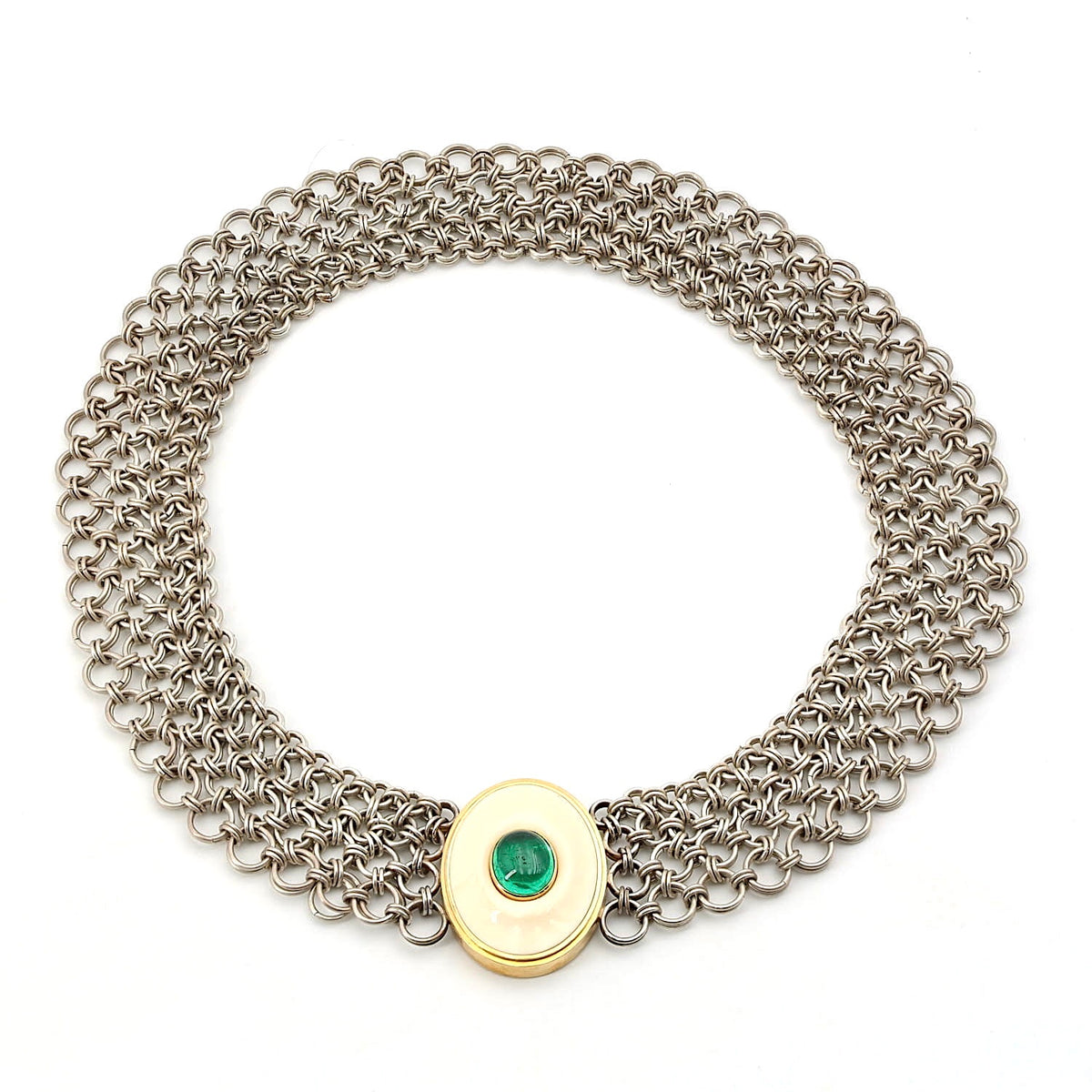 Vintage necklace made of silver, 750 yellow gold and a plate made of bone with an oval emerald cabochon, lying closed