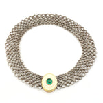 Vintage necklace made of silver, 750 yellow gold and a plate made of bone with an oval emerald cabochon, lying closed