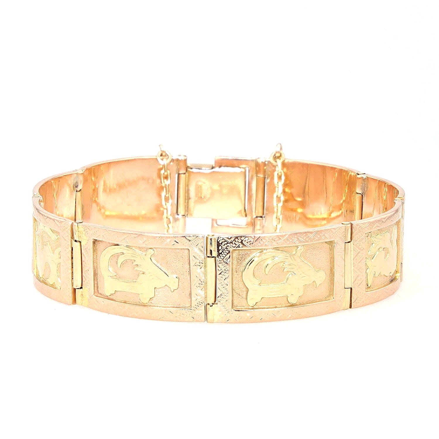 Vintage bracelet in 585 red gold with various motifs, lying frontally