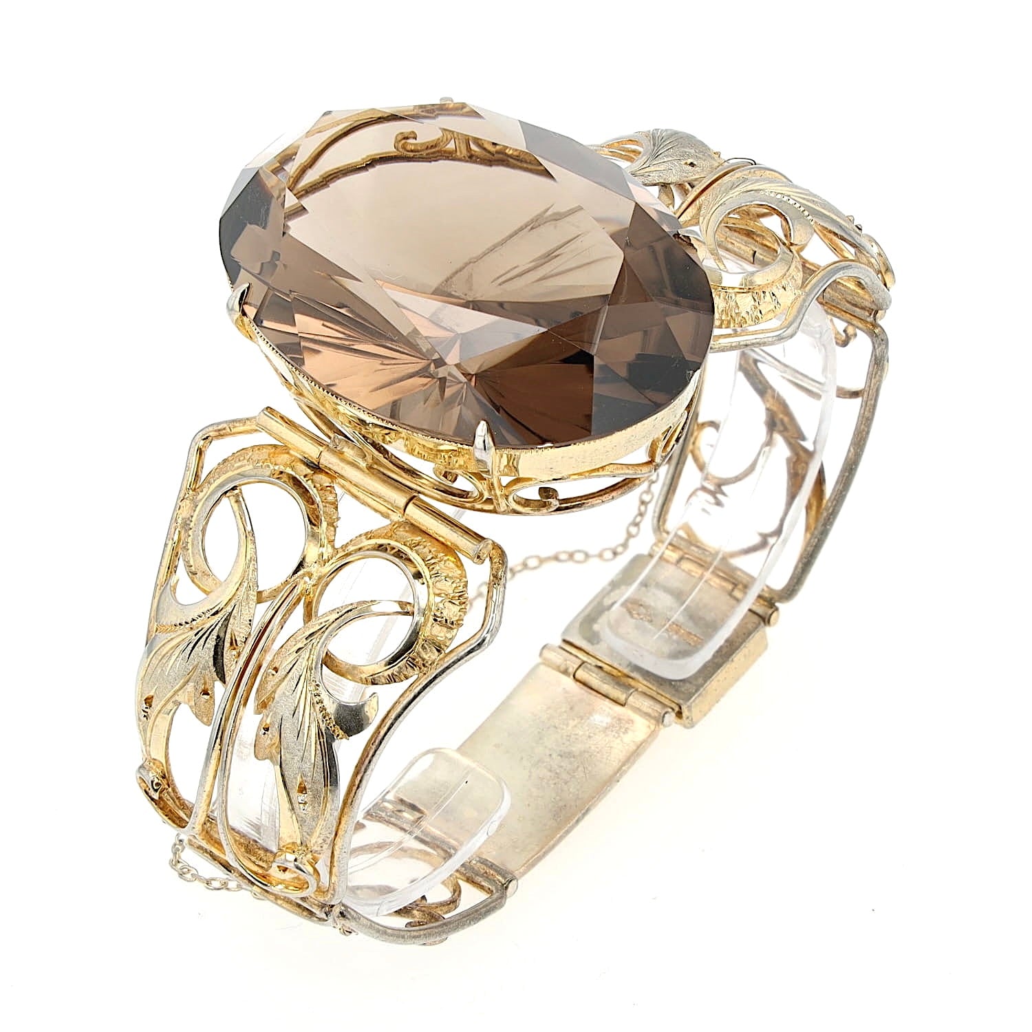 Armband in Silber, vergoldet mit einem großen Rauchquarz 131 ct, stehend auf einem Plastikreif