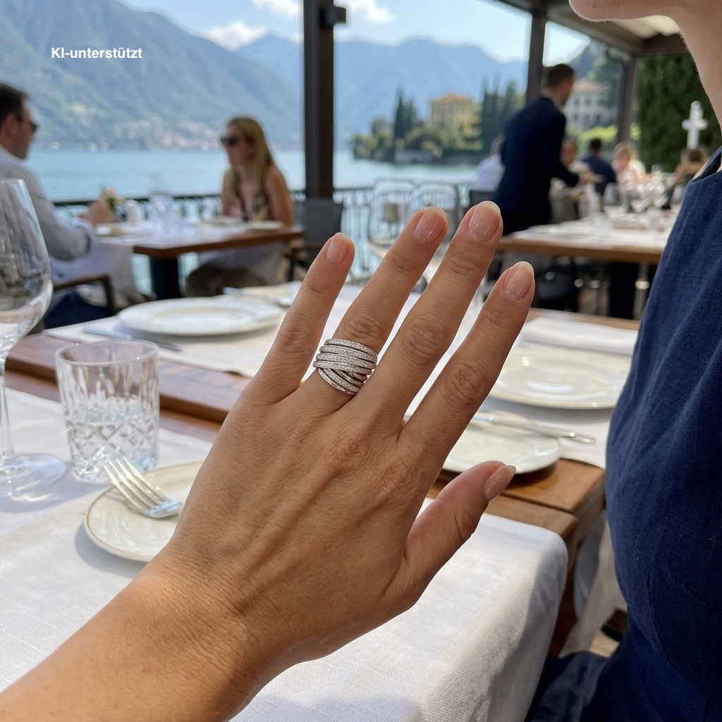 K di Kuore Cross over ring in 750 white gold with a total of approx. 1.15 ct Brilliants, on a KIU-generated woman's hand
