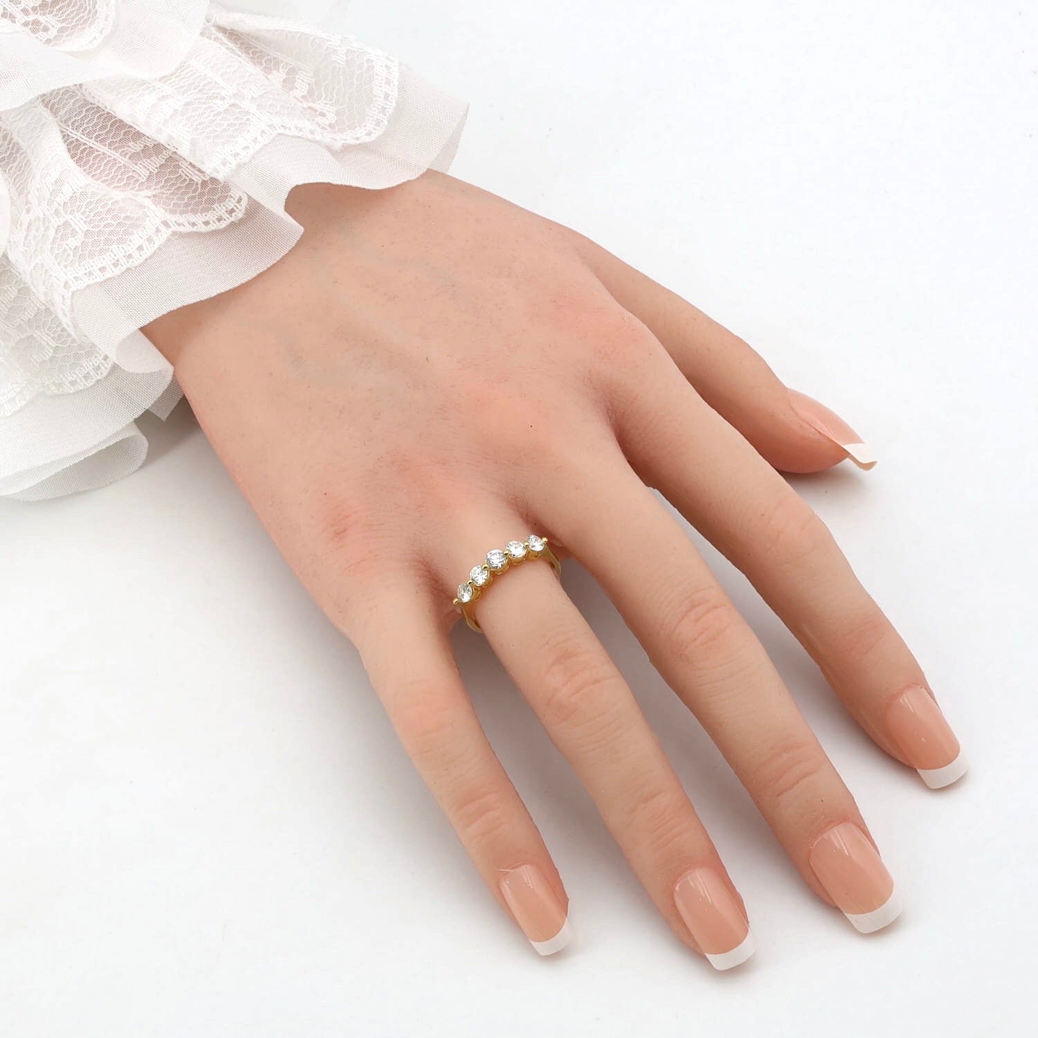 Ring in 750 yellow gold with a total of approx. 0.75 ct Brilliants, on an artificial hand